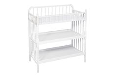 a white baby crib with two shelves on each side and one shelf below it