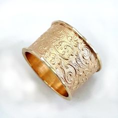 The lacy, delicate pattern is what makes this wide 10k gold ring a popular choice. It's a gorgeous wide gold ring, perfect for a wedding band, and is especially suited to a woman with long, elegant fingers. Alternative base: the ring is available with a sterling silver base: http://etsy.me/2roZkco Instead of 10k gold, the ring is also available in 14k gold. Please contact us. Width: 0.54 inch / 13.5 mm Thickness: 0.06 inch / 1.5 mm This listing is for sizes 4-11- Just convo me your size. For oth Heirloom Yellow Gold Wide Band Ring, Heirloom 14k Gold Wide Band Ring, Heirloom Engraved Ring With Decorative Wide Band, 14k Gold Filigree Wedding Ring With Decorative Band, Heirloom 14k Gold Wide Band Wedding Ring, Elegant Wide Band Ring With Decorative Band, Elegant Yellow Gold Wide Band Ring With Decorative Band, Elegant Wide Band In Yellow Gold, 14k Gold Heirloom Wide Band Engraved Ring