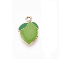 Juicy! Enamel Lime Charm.  Measures  3/4 x 1/2 inch. Gold plated Zinc alloy, lead-free. Comes with a jump ring not shown in pictures.  **Get this Charm for FREE with the purchase of any charm bracelet  Good for charm bracelets, handbag charms, zipper pulls, and pendants, key rings, keychains and earrings.  All items in stock and ships from Tennessee. Green Enamel Charm Jewelry, Nickel Free Enamel Pendant Charms, Green Enamel Jewelry With Charms, Nickel-free Enamel Pendant Charms, Green Pendant Charms For Gifts, Hypoallergenic Green Enamel Jewelry, Nickel Free Enamel Charms For Jewelry Making, Nickel-free Enamel Charms For Jewelry Making, Nickel-free Green Charms For Gifts