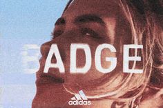 a woman's face with the word adidas in front of her