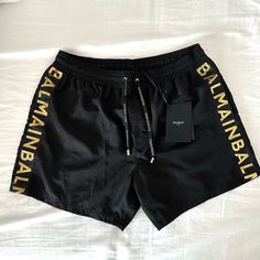 Authentic Balmain Logo Print Swim Shorts Black And Gold Size Medium. Brand New Retail Price $329.00 Balmain Paris, Printed Swim, Man Swimming, Swim Shorts, New Color, The Dreamers, Swimming, Man Shop, Brand New