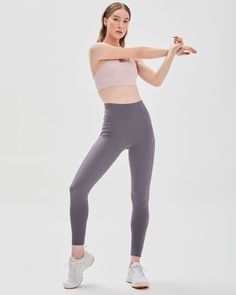 Featuring zip up pockets and stylized seam lines to create an elevated yet stylish performance legging. Our signature Silkiflex™ fabric is 4 way stretch and the ideal support for any workout, from yoga to high intensity cardio. The luxuriously shiny finish wicks away sweat and keeps you cool during your most intense moments. Machine Wash Inseam 27" Model is 5'7" wearing size S Versatile Stretch Gray Activewear, Versatile Gray Stretch Activewear, Versatile Gray Compression Activewear, Versatile Gray High Stretch Activewear, Gray Elastane 4-way Stretch Activewear, Gray 4-way Stretch Elastane Activewear, Gray Elastane Activewear With 4-way Stretch, Gray 4-way Stretch Activewear For Yoga, Gray Elastane Activewear For Pilates