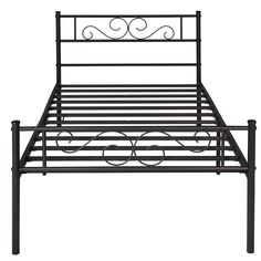 a metal bed frame with an intricate design