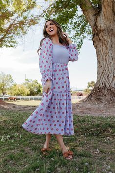 Introducing our Daisy Mae Maxi Dress, the perfect summer addition. This lightweight dress in a beautiful lavender hue is cute and comfortable with a red daisy print. Perfect for any summer occasion, stay stylish and breezy in our Daisy Mae Maxi Dress. Paired with THE BOW SANDALS IN TAN Square neckline Smocked stretchy bodice Maxi length Ruffle sleeve detail 95% Polyester 5% spandex Runs true to size. Small (0-2), Medium (2-4), Large (4-6), X-Large (6-8) Length (from shoulder to hem): Small: 43.5 Tan Square, Happy Threads, Summer Goddess, Pink Desert, Daisy Mae, Red Daisy, Bow Sandals, Swimming Outfit, Lightweight Dress