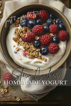 yogurt with berries, raspberries and granola on top in a bowl