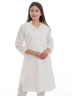 NstoreIN brings beautiful Machine Chikan Embroidered good quality Kurta for women. This classy short kurta is well crafted in fine Cotton for superb softness, comfort and drape, it's embroidered chikankari pattern, regular fit design and a trendy shape make it the perfect fashion choice for many an occasion. Pair this short black chikankari kurti with bangle earrings for an elegant look. The lovely design forms a substantial feature of this wear. It looks stunning every time you match it with accessories. White Embroidered V-neck Kurta, White V-neck Blouse With Chikankari Embroidery, White Straight Kurta Top For Eid, White Cotton Traditional Wear For Spring, Traditional White Straight Kurta Top, White Embroidered Straight Kurta Blouse, White Embroidered Straight Kurta Top, Casual Kurta With Resham Embroidery, Festive White Straight Kurta Top