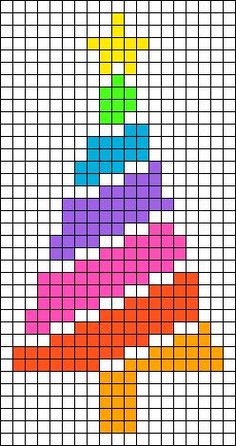 a cross stitch christmas tree made with squares and colored pencils on the bottom half of it