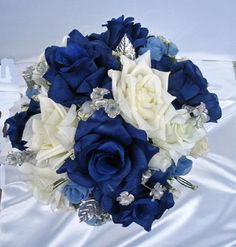 a bridal bouquet with blue and white flowers