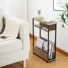 a living room with a white chair and a table on the floor next to a couch