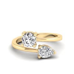 two pear shaped diamond engagement rings in yellow gold