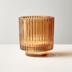 a glass vase sitting on top of a table