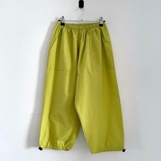 Description: Vintage Green Yellow Cropped 90s Cargo Pants Trousers. Made in England. 65% Polyester, 35% Viscose Measurementsstrong>Waist: 61cm, Inside Leg: 46cm, Outside Leg: 80cm 90s Style Baggy High Waist Pants, 90s Baggy High Waist Pants, 90s High Waist Baggy Pants, 90s Style Baggy Wide Leg Bottoms, Oversized Wide Leg 90s Bottoms, 90s Style Oversized Wide Leg Bottoms, 90s Oversized Wide Leg Bottoms, 90s Style Baggy Wide Leg Pants, Green Tapered Leg Pants With Pull-on Style