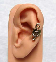 "This treble clef is simple yet have a beautiful detail design, and is set nicely a adjustable ear cuff for your comfort needs. Treble clef ear cuff is approximately 19mm tall x 10mm wide ( 3/4\" x 3/8\" ). Treble clef right ear. https://www.etsy.com/listing/127399712/treble-clef-musical-ear-cuff-right-ear Other ear cuffs https://www.etsy.com/shop/ranaway?section_id=12267071 This listing is for one treble clef ear cuff. Unisex item, make the perfect gift for yourself or someone special. For more Adjustable Metal Hypoallergenic Ear Cuff, Adjustable Hypoallergenic Metal Ear Cuff, Adjustable Brass Pierced Ear Cuff, Adjustable Nickel-free Metal Ear Cuff, Adjustable Metal Nickel-free Ear Cuff, Wonderful Nature, Detail Design, Treble Clef, Ear Cuffs