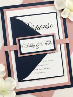 a close up of a wedding card with flowers