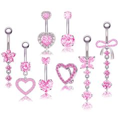 six different types of belly piercings with pink crystal hearts and bows on each side