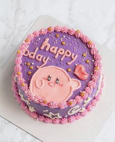 a birthday cake with pink icing and purple frosting that says, happy baby