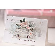 a card with an old car and flowers on it