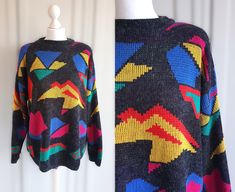 * Vintage pullover sweater by Ragazza * Gray and colorful geometric print color * The arms are stiffened with pillows * Made in Italy Size label - M / L Chest - 50 inch / 127 cm Length - 27,5 inch / 70 cm Sleve from the neck - 30 inch / 76  cm You can also check other items from my shop: https://www.etsy.com/shop/FadoVintageShop Thank you for visiting my shop ! Retro Multicolor V-neck Sweater, Multicolor Graphic Print Knit Sweater, Vintage Pullovers, Geometric Print, Pullover Sweaters, Sweater Outfits, Old School, Knitted Sweaters, Jumper