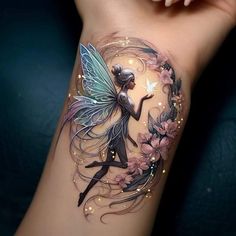 a woman's arm with a tattoo on it and a fairy holding a flower