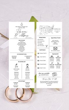 two wedding rings on top of each other next to a white and green program card