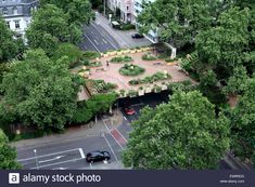 an aerial view of a park in the middle of a city with lots of trees