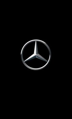 the mercedes logo is shown against a black background