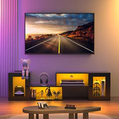 a living room with a large television mounted on the wall and purple lighting in front of it