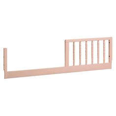 a pink wooden bed frame with rails on the bottom and sides, against a white background