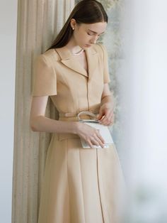 This is BAU by Bride And You’s mini dress, beloved for its classic design, features luxurious textured fabric and jacket-style details on the top, emphasizing a classic mood. The flared skirt adds to its femininity. The V-neck notched collar creates a slender neckline, while the spacious shoulder line covers the arms. Inside the skirt, there's a full lining that accentuates the skirt line, creating a more dimensional silhouette and structural body line.- Perfect for both daily wear and special occasions- Can be styled with various accessories to create different looks- Features a zipper at the back for easy wearing and removal- Pairing it with the optional belt provided will enhance the overall look Classic Mood, Dinner Dress, Classic Dress, Flared Skirt, Notched Collar, Textured Fabric, Flare Skirt, Jacket Style, Shopping List