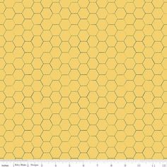 an abstract yellow background with hexagons in the shape of honeycombs