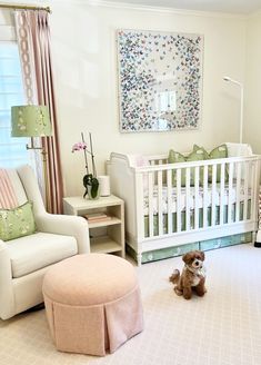 a baby's room is decorated in pastel colors