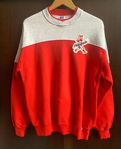 Fantastic Red & Gray, vintage Russell Athletic colorblock crewneck, Made in USA. Upcycled with 1 sewn, vintage original 'Philadelphia' patch on Left Chest. Tagged Size XL mens/unisex and fits as a Large/XL. Sweatshirt is very good, vintage condition, with expected pilling and no stains, wear or tear. Go Phils! Shipped via USPS Priority. College Crew Neck Tops With Patchwork, Crew Neck Patchwork Tops For College, College Patchwork Cotton Sweatshirt, College Cotton Patchwork Sweatshirt, Patchwork Cotton Tops For College, Sporty Patchwork Tops For College, College Crew Neck Patchwork Sweatshirt, Retro Color Block Crew Neck Sweatshirt, Sporty Patchwork Crew Neck Sweatshirt