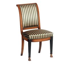 a wooden chair with striped upholstered back and seat cushion on the side, against a white background