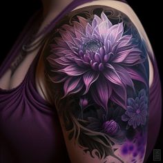 a woman's arm with purple flowers and leaves on the back of her body