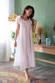 This beautiful lightweight cotton voile nightgown features sweet frills and a ruffled neckline, that can be worn on or off the shoulders Size S (4-6 ) Bust 82-87 cm (32'-34') Waist 63-67 cm (24'-26') Hips 89-96 cm (35'-37') Insteam 63 cm (24') Sleeve 57,5 cm (23') M (8-10) Bust 89-94cm (35'-37') Waist 63-67 cm (24'-30') Hips 89-96 cm (38'-41') Insteam 64 cm (25') Sleeve 61 cm (24') L (12) Bust 98-110 cm (38'-43') Waist 83-93 cm (32'-36') Hips 105 cm (41'-45') Insteam 66 cm (26') Sleeve 63 cm (25 Cotton Summer Nightgown, Summer Loungewear Nightgown With Ruffles, Ruffled Nightgown For Summer Nights, Cottagecore Bedtime Dresses For Summer, Feminine Ruffled Nightgown For Summer, White Ruffled Dress For Home, Sleeveless Ruffled Nightgown For Loungewear, Spring Ruffled Sleepwear For Night, Summer Home Dress With Ruffles