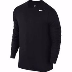 the nike long - sleeved shirt is black and has a white logo on it