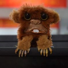 a small stuffed animal sitting on top of a table