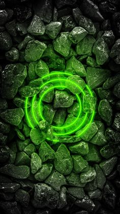 a green circle on some rocks in the middle of it's glows up