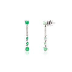 These elegant long dangle earrings feature vivid emeralds complemented by sparkling diamonds, creating a luxurious cascade of color and brilliance. The rich green emeralds are set in a refined design, accentuated by the shimmering diamonds that catch the light with every movement. Perfect for special occasions, these earrings add a touch of sophistication and glamour, making them a timeless addition to any jewelry collection. This is a perfect May Birthstone Jewelry also perfect Engagement Gift, Elegant Green Drop Linear Earrings, Green Diamond Dangle Earrings For Formal Occasions, Green Dangle Diamond Earrings For Formal Occasions, Elegant Green Diamond Dangle Earrings, Elegant Green Dangle Diamond Earrings, Green Linear Drop Earrings For Formal Occasions, Elegant Green Dangle Linear Earrings, Perfect Engagement Gifts, Metal Drop