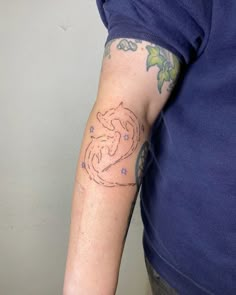 a person with a tattoo on their arm