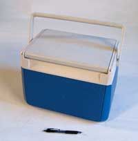 a blue and white cooler sitting on top of a table next to a black marker