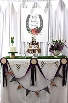 a table topped with a cake and decorations