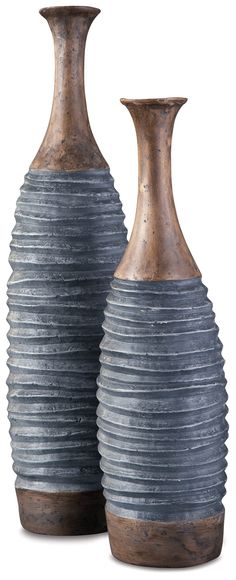 two gray vases sitting next to each other