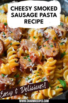 a skillet filled with pasta and sausage in a creamy sauce that is ready to be eaten