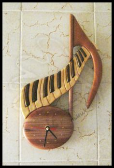 a clock made to look like a musical instrument