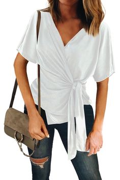 •Cross the neckline to create a natural and casual V-neck •Use a lightweight and elastic cotton fabric to make your skin feel cool and comfortable •Inner and outer ties cinch the waist line to offer a flattering fit •This top is casual and formal, suitable for everyday casual wear as well as office wear •Pair yours with high rise denim and heels for a polished look •Everyday fashion demands simple dropship tops Size Chart (CM) Sizes Bust Sleeve_Length Length Hem_Width Relax Relax Front Relax S 7 Fashion Tape, Simple Tees, Bottoming Shirt, Womens Tops Summer, Loose Tops, Wrap Blouse, High Rise Denim, Slim Fit Shirt, White Short