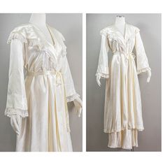 This is a gorgeous white rayon stain 40s peignoir robe. The gown has a large draped shawl collar that is trimmed in a delicate floral lace ruffle. It has wide, slightly belled, long sleeves that also have a lace ruffle attached at the cuffs. The robe is a wrap style and ties shut with a belt that has loops on the side and one in the front. The belt is made of the same satin as the robe and has a lace ruffle on each end and. It's such a fun little detail. The skirt of the robe falls mid-calf to a Vintage Robes, Spool Heel, Pajama Robe, Womens Robes, Lace Ruffle, Shawl Collar, Wrap Style, Mid Calf, Floral Lace