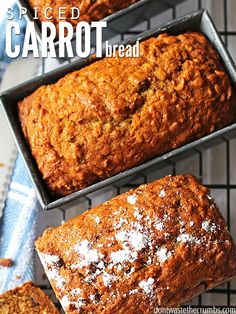 three loafs of carrot bread sitting on top of a cooling rack next to each other