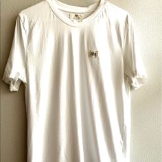 Zara White T-Shirt Short Sleeve 100% Cotton Nwot Zara Logo On The Left Side Everyday Tan Cotton T-shirt, Classic Tan Cotton Tops, Basic White Shirt For Everyday, Casual Tan Cotton T-shirt, Zara White Graphic Tee, Classic Everyday Tops With Graphic Print, Classic Graphic Print Tops For Everyday, Classic Summer Tops With Logo Print, Zara Casual T-shirt With Relaxed Fit