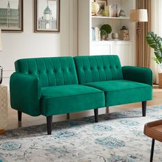 a living room with a green couch in it